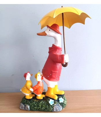 Duck Family Under Umbrella